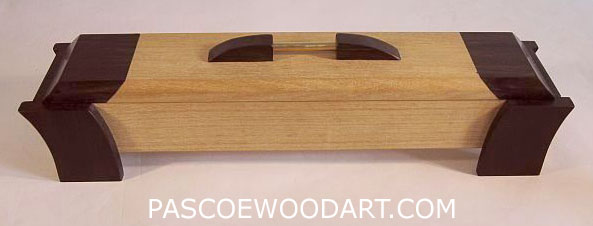 Weekly pill box made from solid ceylon satinwood and ebony - suspended box design